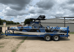 Full vehicle wrap on a wakeboard boat by 1st Class Graphics in Mansfield, TX